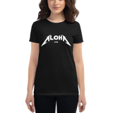 Young female wearing a Aloha Tribe Hawaii shirt that has a Hawaii themed graphic logo on the front.