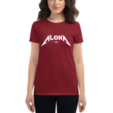 Young female wearing a Aloha Tribe Hawaii shirt that has a Hawaii themed graphic logo on the front.