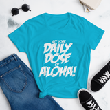 Young female wearing a Aloha Tribe Hawaii shirt that has a Hawaii themed graphic logo on the front.