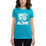 Young female wearing a Aloha Tribe Hawaii shirt that has a Hawaii themed graphic logo on the front.