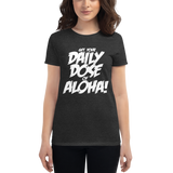Young female wearing a Aloha Tribe Hawaii shirt that has a Hawaii themed graphic logo on the front.
