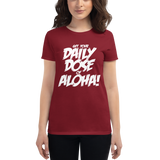 Young female wearing a Aloha Tribe Hawaii shirt that has a Hawaii themed graphic logo on the front.