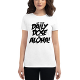 Young female wearing a Aloha Tribe Hawaii shirt that has a Hawaii themed graphic logo on the front.