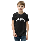 Preteen model wearing a Aloha Tribe Hawaii T-shirt that has a Hawaii themed graphic logo on the front.