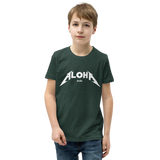 Preteen model wearing a Aloha Tribe Hawaii T-shirt that has a Hawaii themed graphic logo on the front.