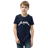 Preteen model wearing a Aloha Tribe Hawaii T-shirt that has a Hawaii themed graphic logo on the front.