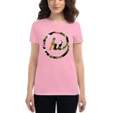 Young female wearing a Aloha Tribe Hawaii shirt that has a Hawaii themed graphic logo on the front.