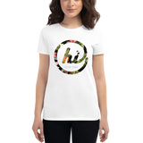 Young female wearing a Aloha Tribe Hawaii shirt that has a Hawaii themed graphic logo on the front.