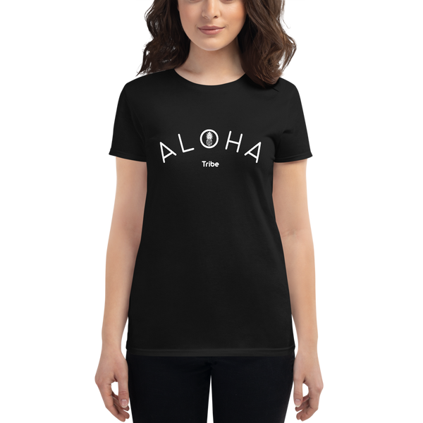 Young female wearing a Aloha Tribe Hawaii shirt that has a Hawaii themed graphic logo on the front.