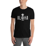 Young male adult wearing a Alter Ego Hawaii T-shirt that has a Hawaii themed graphic logo on the front.