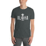 Young male adult wearing a Alter Ego Hawaii T-shirt that has a Hawaii themed graphic logo on the front.