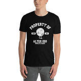 Young male adult wearing a Alter Ego Hawaii T-shirt that has a Hawaii themed graphic logo on the front.