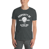 Young male adult wearing a Alter Ego Hawaii T-shirt that has a Hawaii themed graphic logo on the front.