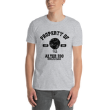 Young male adult wearing a Alter Ego Hawaii T-shirt that has a Hawaii themed graphic logo on the front.