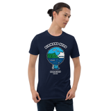 Young male adult wearing a Alter Ego Hawaii T-shirt that has a Hawaii themed graphic logo on the front.