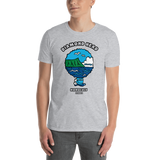 Young male adult wearing a Alter Ego Hawaii T-shirt that has a Hawaii themed graphic logo on the front.