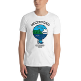 Young male adult wearing a Alter Ego Hawaii T-shirt that has a Hawaii themed graphic logo on the front.