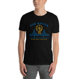 Young male adult wearing a Alter Ego Hawaii T-shirt that has a Hawaii themed graphic logo on the front.