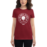 Young female wearing a Alter Ego Hawaii shirt that has a Hawaii themed graphic logo on the front.