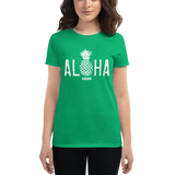 Young female wearing a Alter Ego Hawaii shirt that has a Hawaii themed graphic logo on the front.