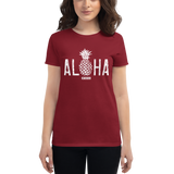 Young female wearing a Alter Ego Hawaii shirt that has a Hawaii themed graphic logo on the front.