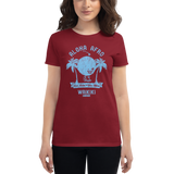 Young female wearing a Alter Ego Hawaii shirt that has a Hawaii themed graphic logo on the front.