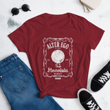 Young female wearing a Alter Ego Hawaii shirt that has a Hawaii themed graphic logo on the front.