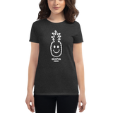 Young female wearing a Alter Ego Hawaii shirt that has a Hawaii themed graphic logo on the front.