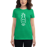 Young female wearing a Alter Ego Hawaii shirt that has a Hawaii themed graphic logo on the front.