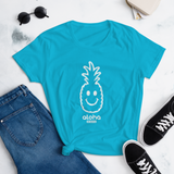 Young female wearing a Alter Ego Hawaii shirt that has a Hawaii themed graphic logo on the front.