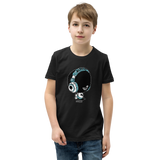 Preteen model wearing a Alter Ego Hawaii T-shirt that has a Hawaii themed graphic logo on the front.