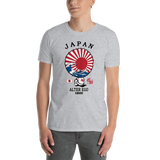 Young male adult wearing a Alter Ego Hawaii T-shirt that has a Hawaii themed graphic logo on the front.
