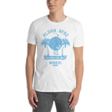 Young male adult wearing a Alter Ego Hawaii T-shirt that has a Hawaii themed graphic logo on the front.