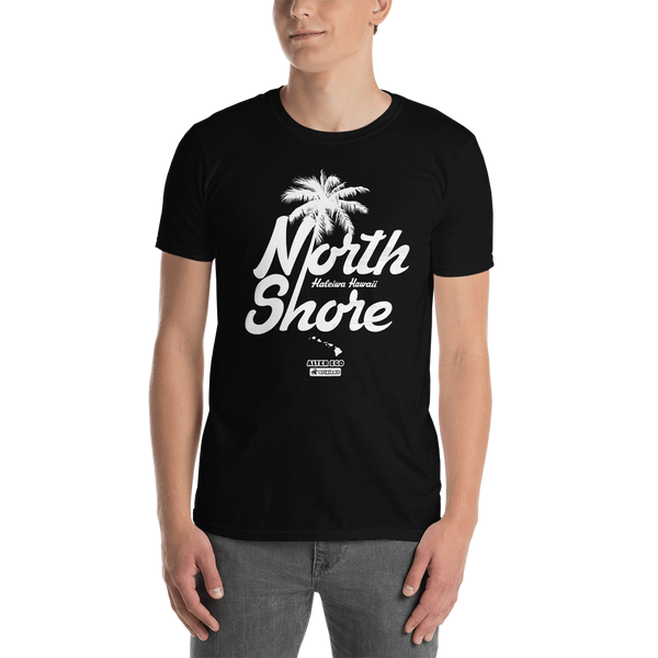 Young male adult wearing a Alter Ego Hawaii T-shirt that has a Hawaii themed graphic logo on the front.