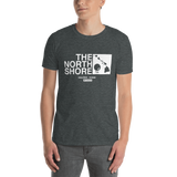 Young male adult wearing a Alter Ego Hawaii T-shirt that has a Hawaii themed graphic logo on the front.