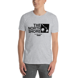 Young male adult wearing a Alter Ego Hawaii T-shirt that has a Hawaii themed graphic logo on the front.