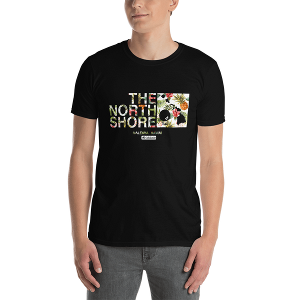 Young male adult wearing a Alter Ego Hawaii T-shirt that has a Hawaii themed graphic logo on the front.