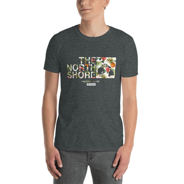 Young male adult wearing a Alter Ego Hawaii T-shirt that has a Hawaii themed graphic logo on the front.