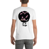 Young male adult wearing a Alter Ego Hawaii T-shirt that has a Hawaii themed graphic logo on the front.