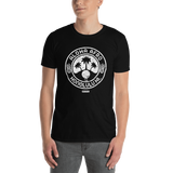 Young male adult wearing a Alter Ego Hawaii T-shirt that has a Hawaii themed graphic logo on the front.