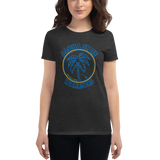 Young female wearing a Rhythm Arts shirt that has a Hawaii themed graphic logo on the front.