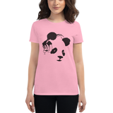 Young female wearing a Rhythm Arts shirt that has a Hawaii themed graphic logo on the front.