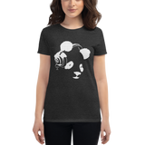 Young female wearing a Rhythm Arts shirt that has a Hawaii themed graphic logo on the front.