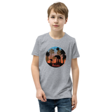 Preteen model wearing a Rhythm Arts Hawaii T-shirt that has a urban street themed graphic logo on the front.