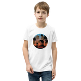 Preteen model wearing a Rhythm Arts Hawaii T-shirt that has a urban street themed graphic logo on the front.