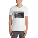 Young male wearing a Rhythm Arts Hawaii T-shirt that has a urban street themed graphic logo on the front.