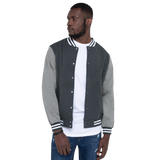 Young model wearing a Rogue Labs Hawaii letterman jacket that has a urban street themed graphic logo on the front.