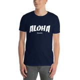 A male model wearing a Aloha Tribe Hawaii T-shirt that has Hawaii themed graphic logos on the front.