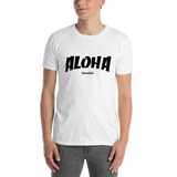 A male model wearing a Aloha Tribe Hawaii T-shirt that has Hawaii themed graphic logos on the front.