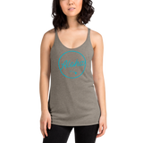 Young female wearing a Aloha Tribe Hawaii racerback tank top that has Hawaii themed graphic logos on the front.